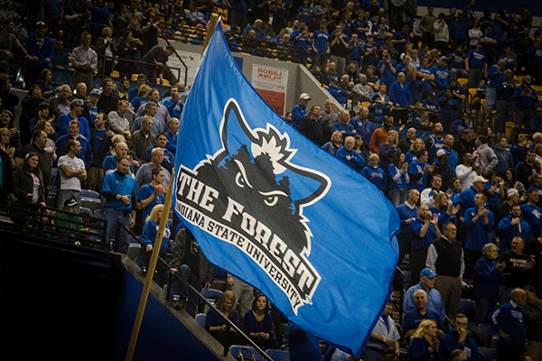 A large flag of the student section, The Forest, waves in front of the stands during a basketball game in Hulman Center.