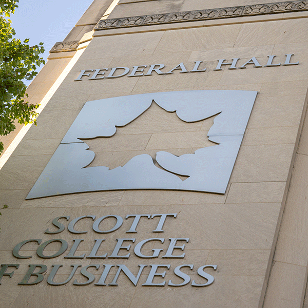 Image of a building with a large metallic Indiana State logo on it and reading “Federal Hall” and “Scott College of Business” 