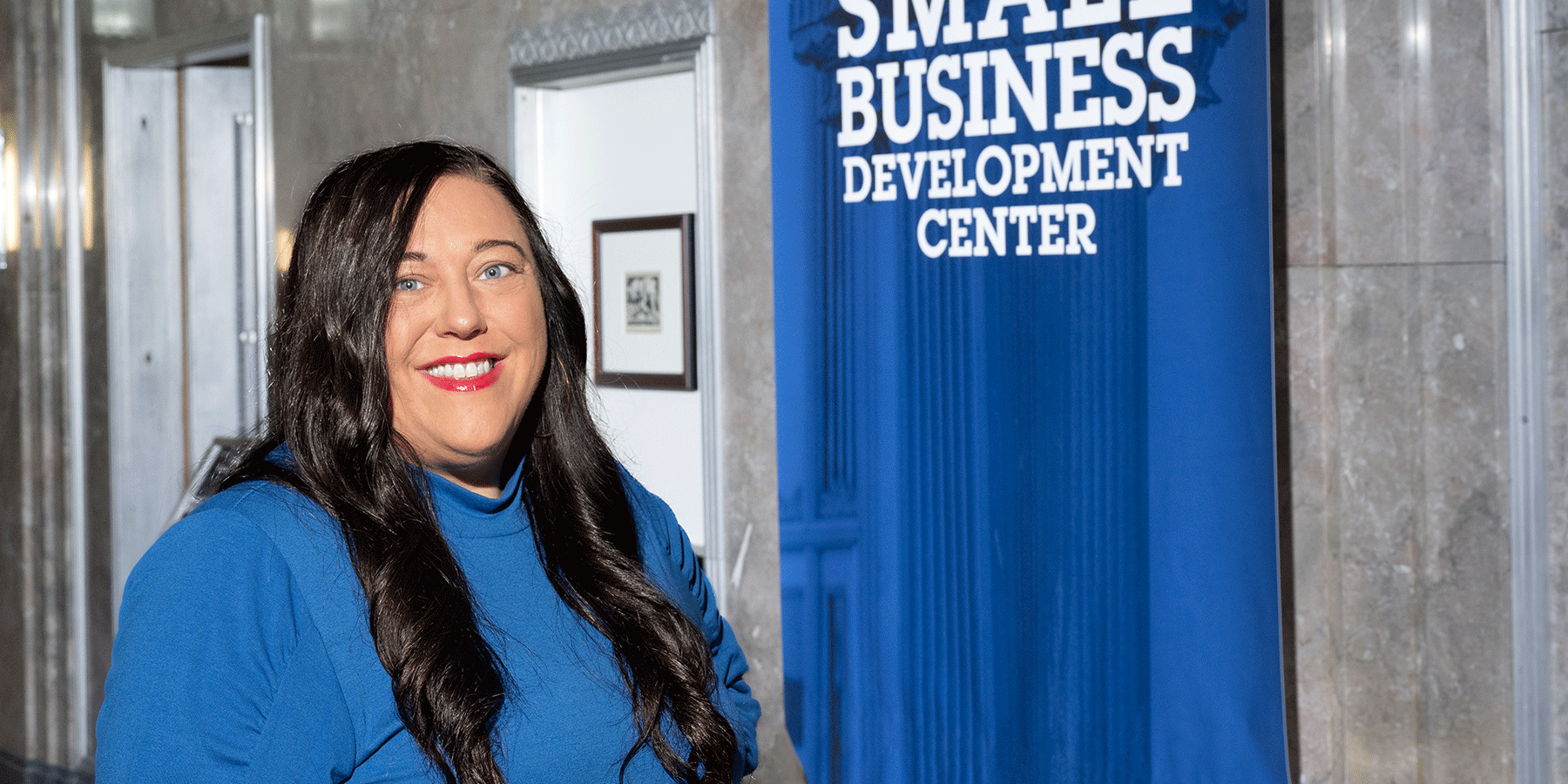 Courtney Richey-Chipol stands in front of the Small Business Development Center