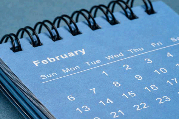 Detail photo of a calendar with dates and the month of February.