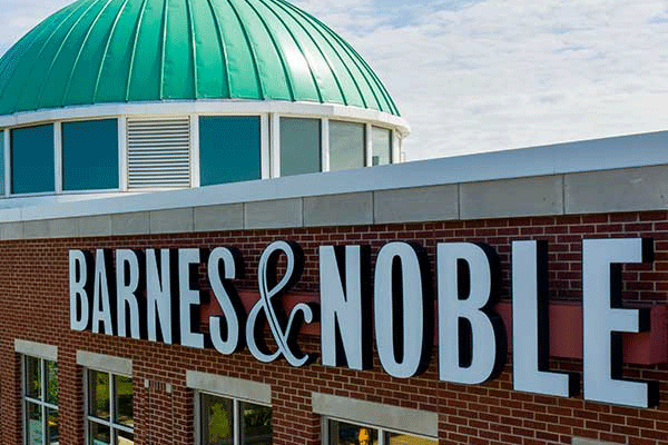 Aerial shot of a building with a green round top and the visible on the side is “Barnes and Noble”