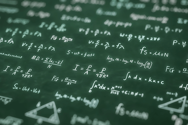 A dark green background with many various math equations written in white ink. Some of the equations are blurred in the photo. 