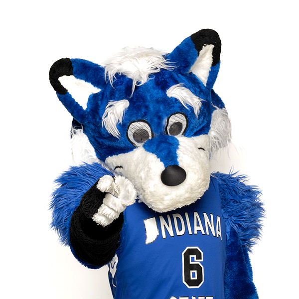 Sycamore Sam, a blue forest woodland creature with a white muzzle, blue and white ears with black tips, white hands, and wearing a blue No. 6 basketball jersey that says Indiana State, points at the camera. Sam is pictured against a white background.