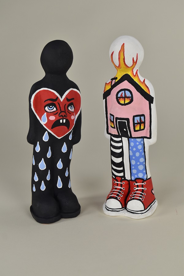 two abstract human form figurines