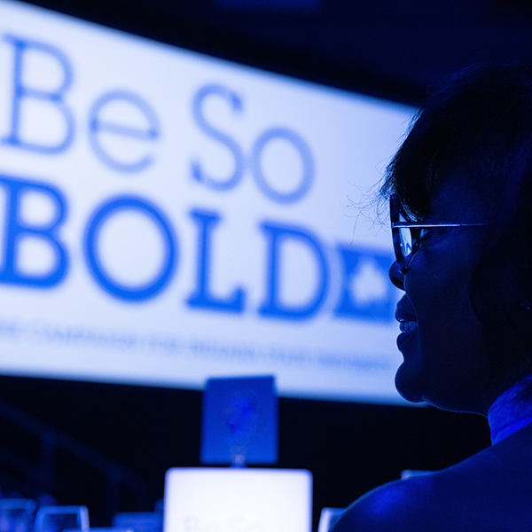 Susan Chaney with the Be So BOLD Logo on a Screen