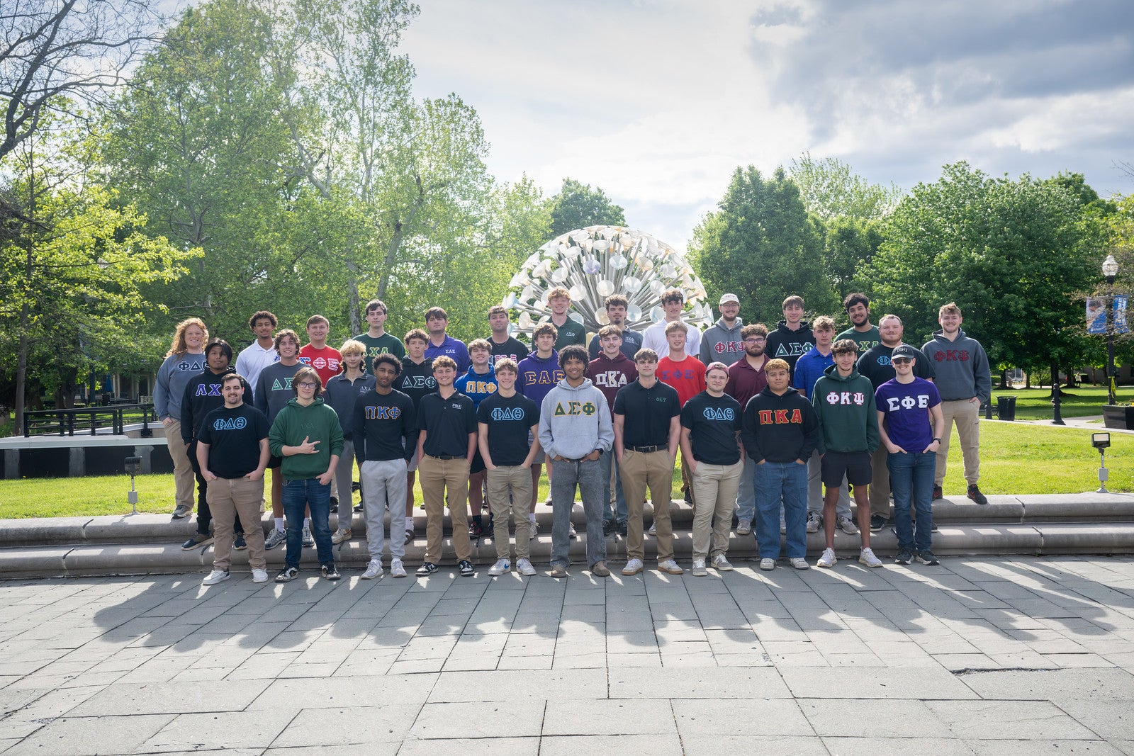 Group photo of the 2026 IFC community in front of Sticky Ball.