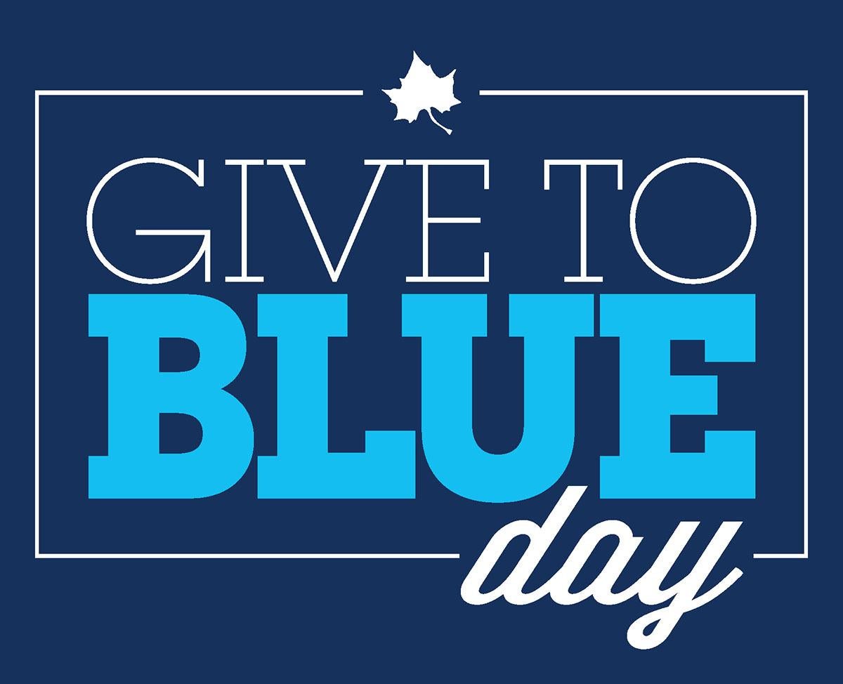 Give to Blue Day logo with white and blue text on a dark blue background and a white sycamore leaf above the text.