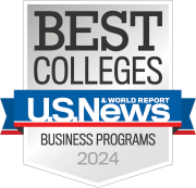 Logo of U.S. News & World Report featuring the text 'BEST COLLEGES', 'USN&WR', and 'Business Programs 2024' on a badge with a gray and white color scheme and blue and red ribbons.
