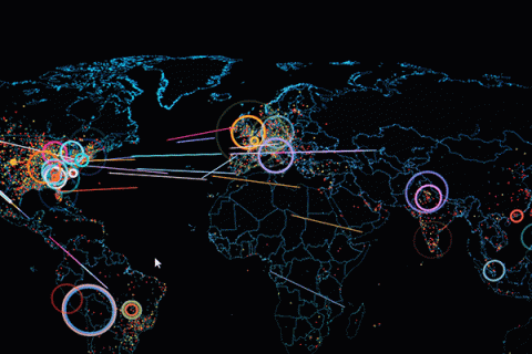 Detailed image of a digital map of the world on a computer screen with colorful lines and markers highlighting areas in the world experiencing a cyber attack. 